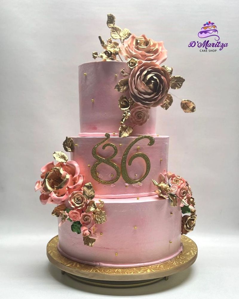 Hand-crafted blush cake with cascading sugar roses