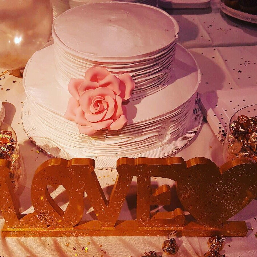 Pink cake with a single rose