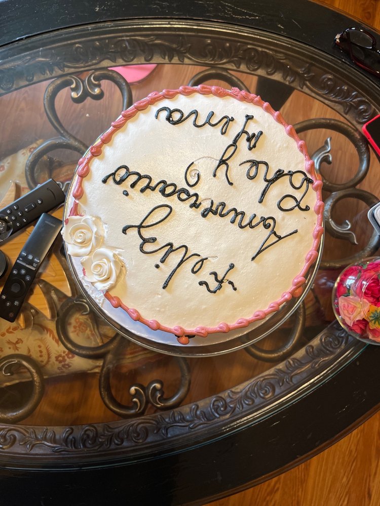 Elegant white cake with gold hand-lettering