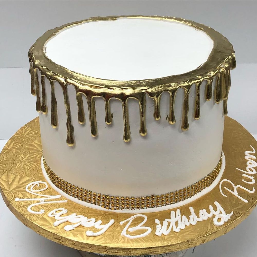 White and gold drip birthday cake