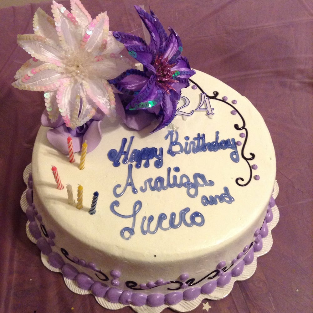 Cake with a large purple sugar flower